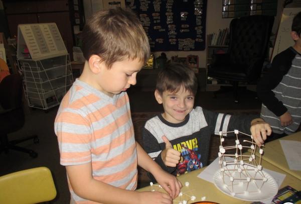 two students building their tower project
