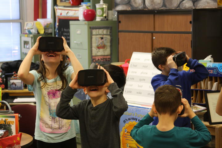 Groups Student exploring with Google expedition VR headset 2