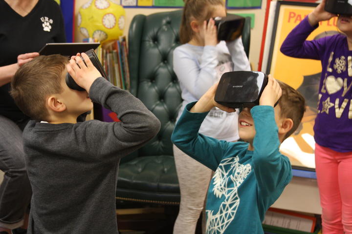 group of student exploring with Google expedition VR headset