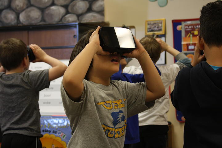Students exploring with Google expedition VR headset
