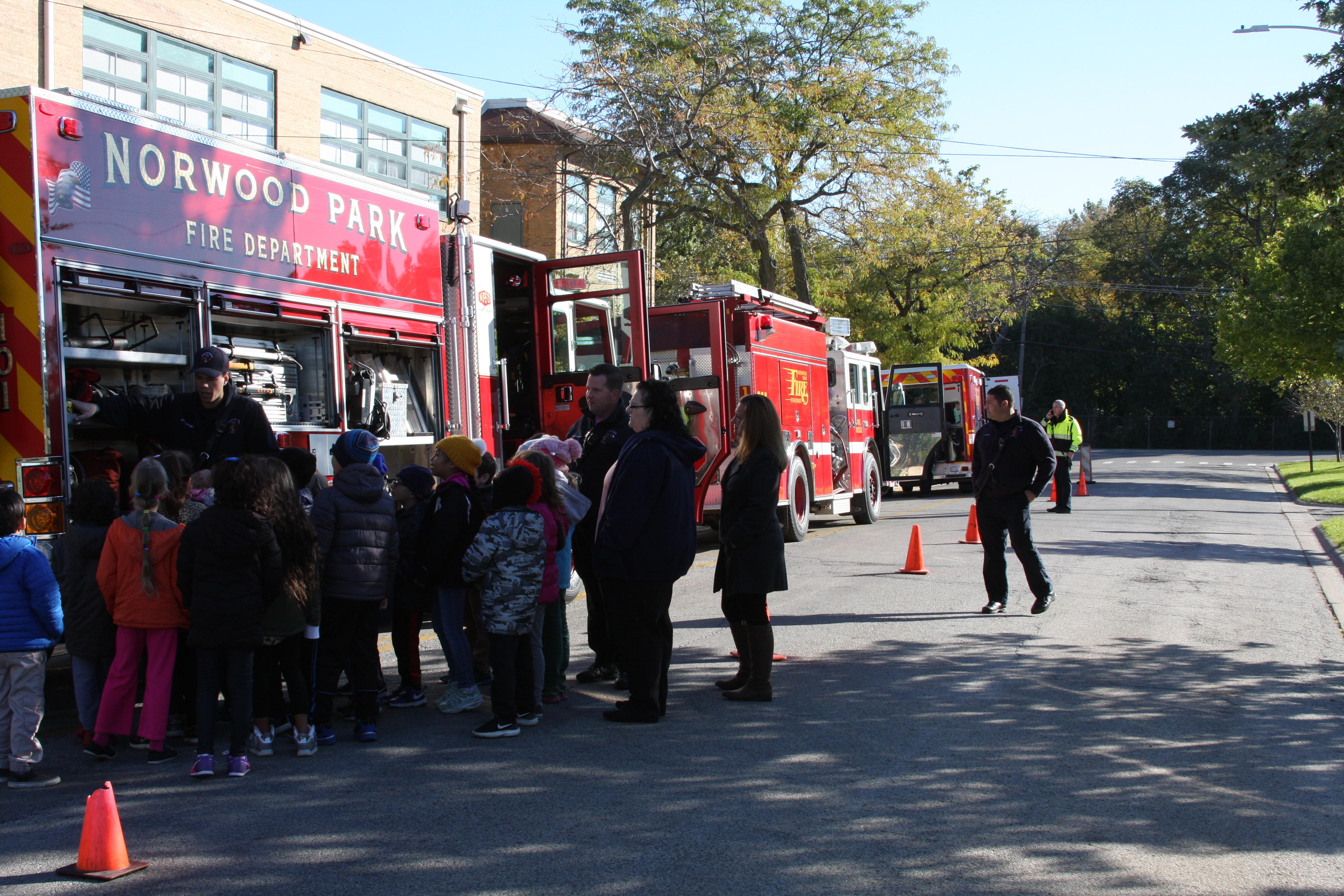 image of students standing by the fire truck