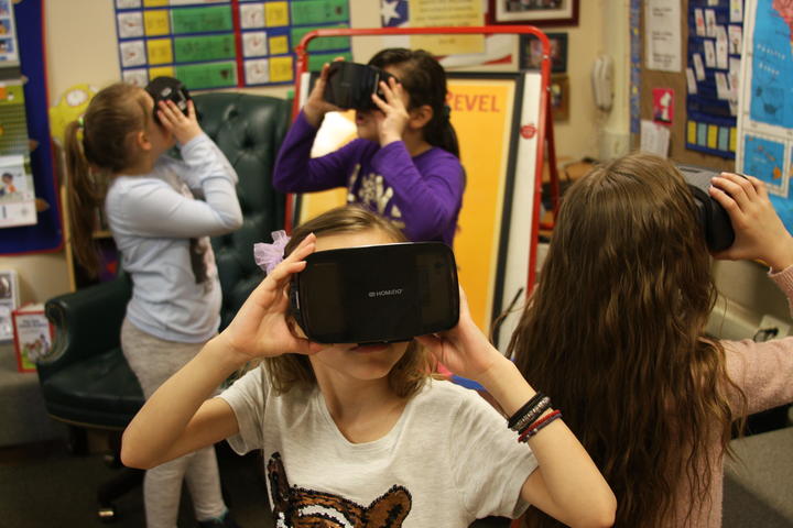 Groups of student exploring with Google expedition VR headset