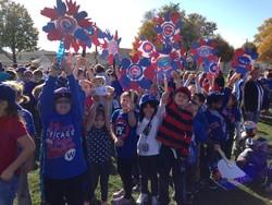 student cheering for theChicago Cubs